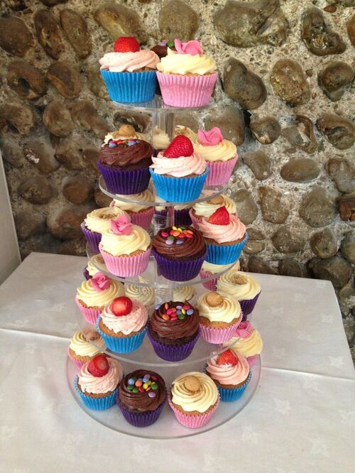 four tire cupcake toppiary with colorful cupcakes