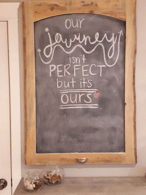 Love quote written on a chalkboard and hung on a wall