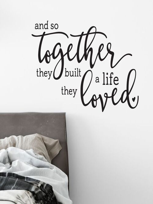 love quote on a wall above bed
