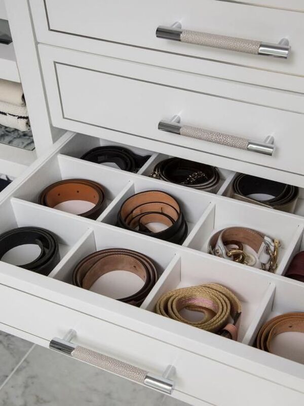 Organize belts in closet drawer