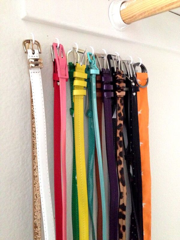 Organize belts in closet on a closet wall