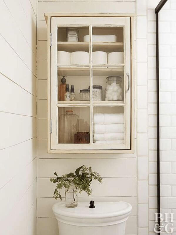 glass cabinet over the toilet storage