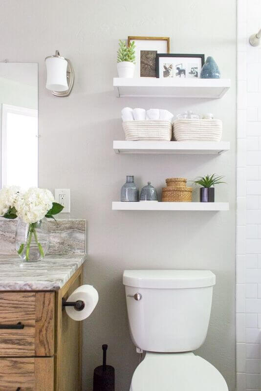 floating shelves over the toilet storage