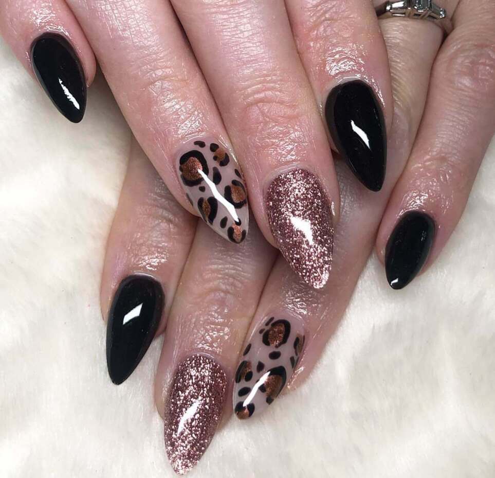 long black and rose gold nails with animal print