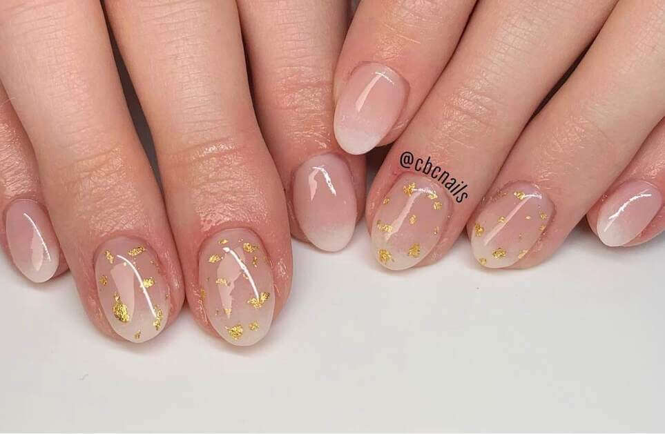 gold graduation nails.