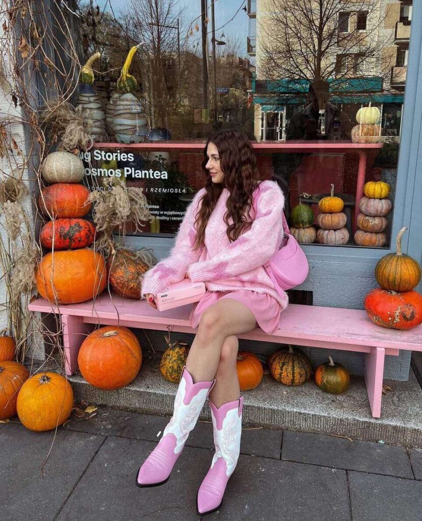 light pink sweater and cowboy boots outfit