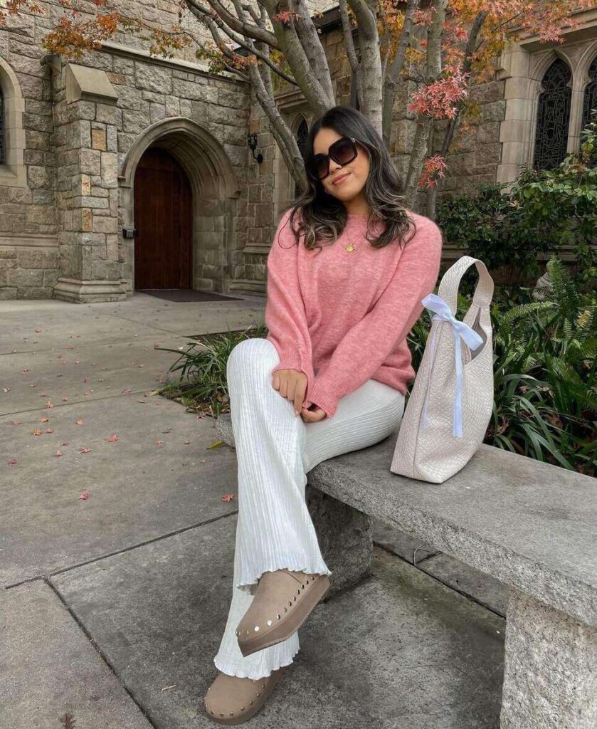 light pink sweater and white pants outfit