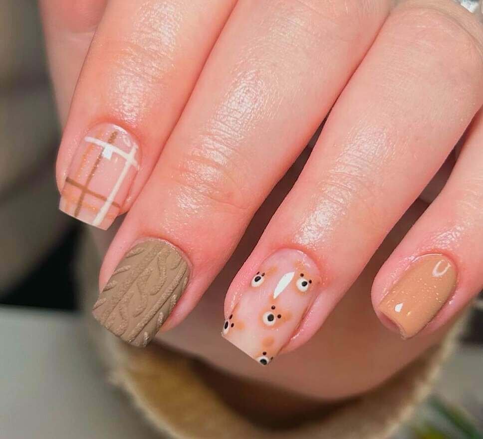 neutral baby shower nails with a bear