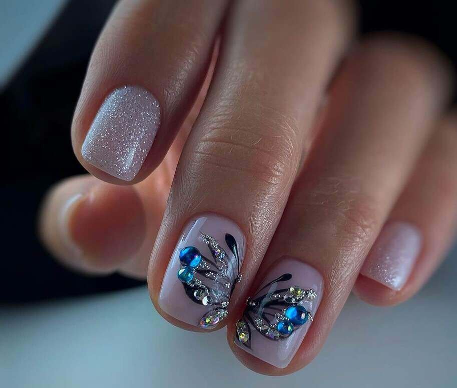 butterfly nails with gemstones