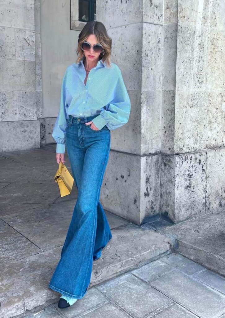 bell bottom jeans and light blue shirt outfit