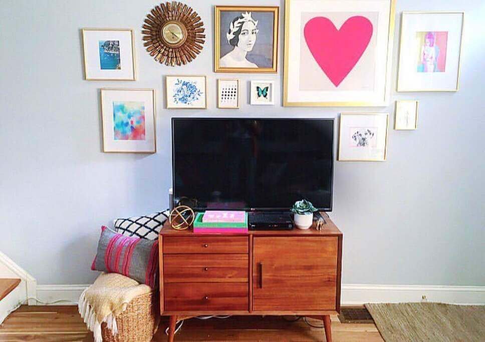 living room tv wall above cabinet