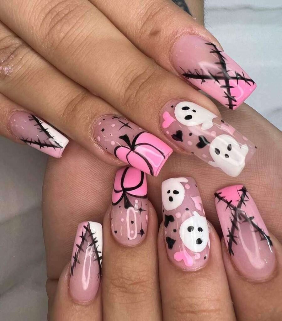 pink halloween nails with ghosts