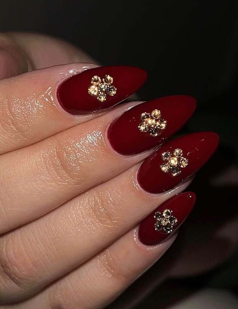 maroon and gold nails 