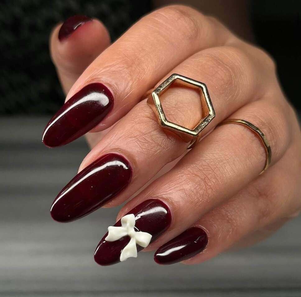 maroon nails with bow