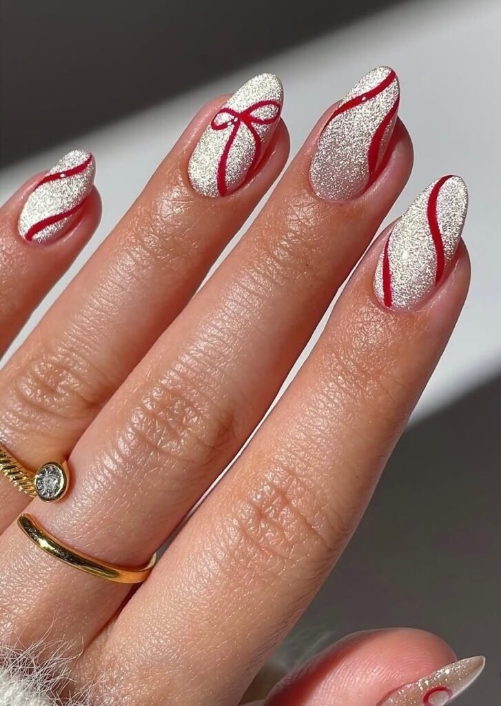 sparkly red bow nails 